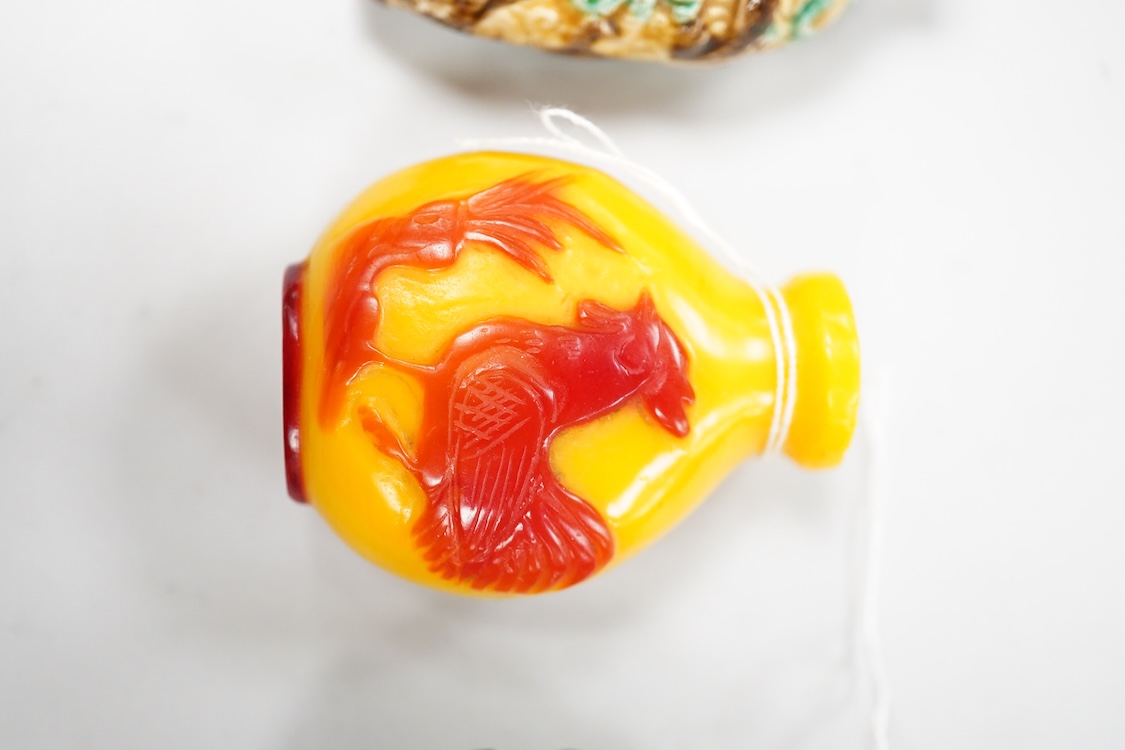 Three Chinese glass snuff bottles and a porcelain snuff bottle(4), tallest 8cm high
